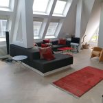 Maßmöbelbau einer Sitzlandschaft mit Aussparung für eine Dachgeschosswohnung